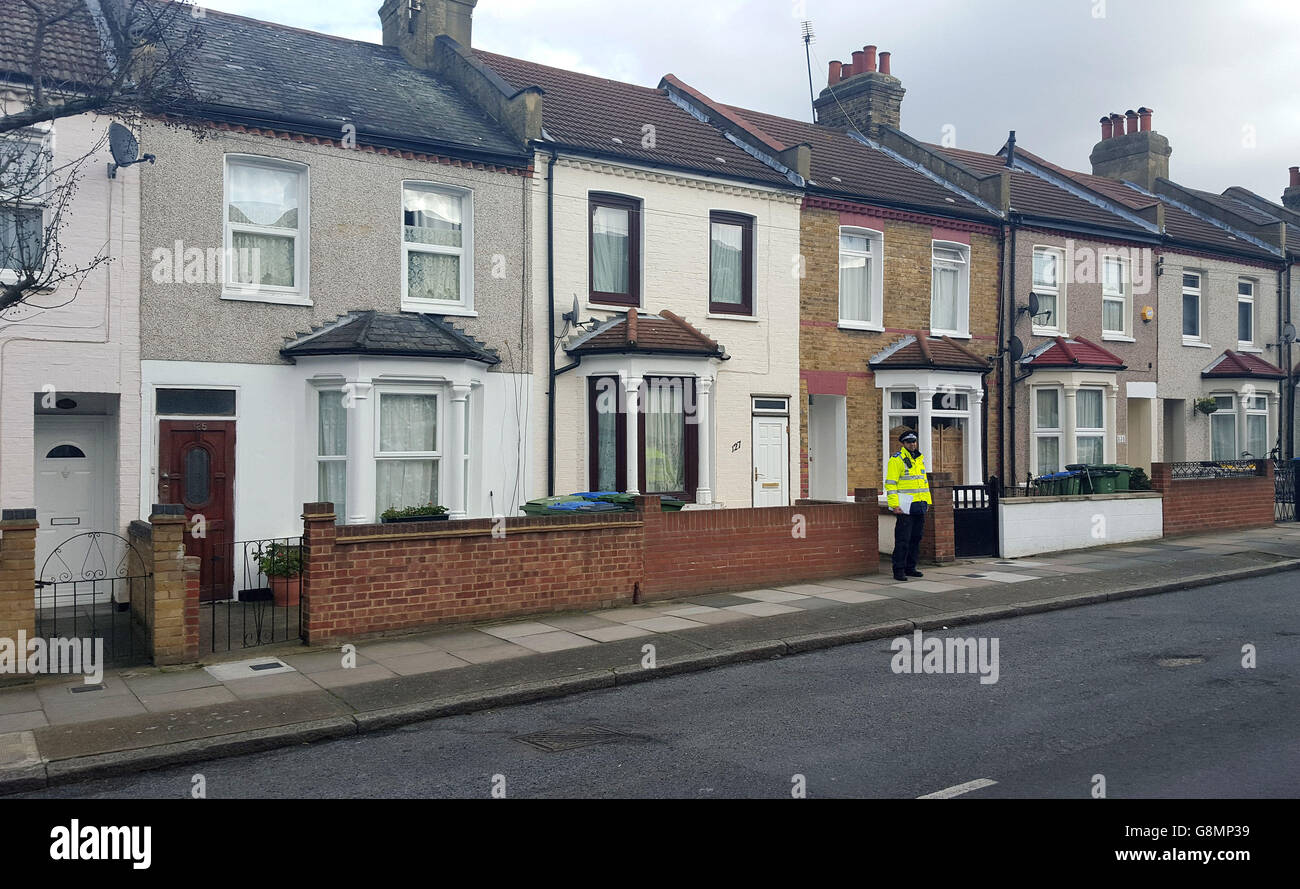 A policeman stands outside a property in Plumstead, London, as 52-year-old Regina Edwards has been charged with murder after her mother Priscilla Edwards was found dead. Stock Photo