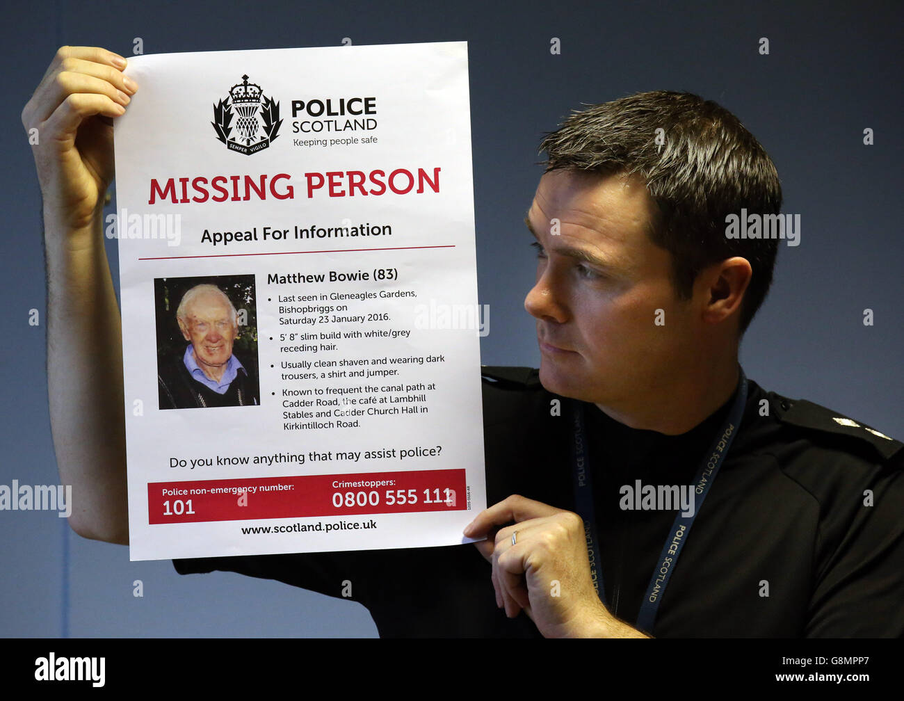 Police Scotland Inspector Gerry Corrigan holds a missing person poster for Matthew Bowie, 83, from Bishopbriggs near Glasgow, after a press conference at Kirkintilloch Police Station. Stock Photo