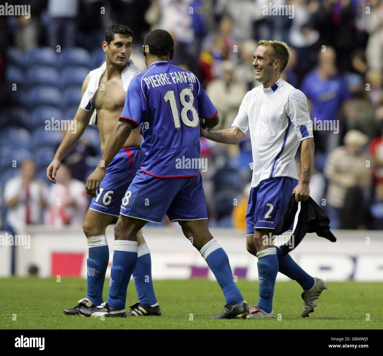 Rangers' Fernando Ricksen (R) is all smiles with Jose Pierre-Fanfan ...