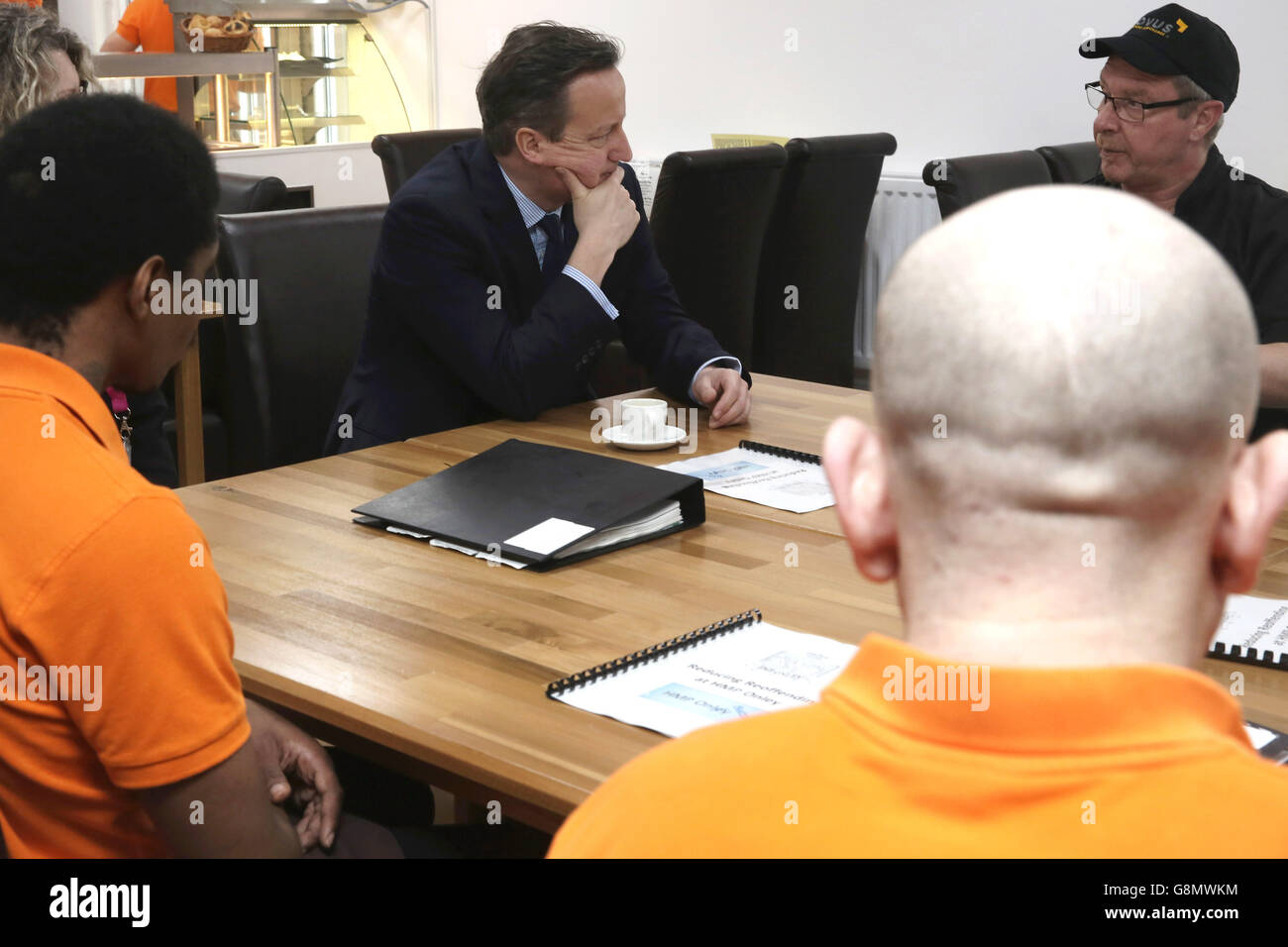 Prime Minister David Cameron has a coffee as he talks to inmates and staff inside The Lock Inn Cafe as he tours HMP Onley in Rugby ahead of a major speech on prison reform. Stock Photo