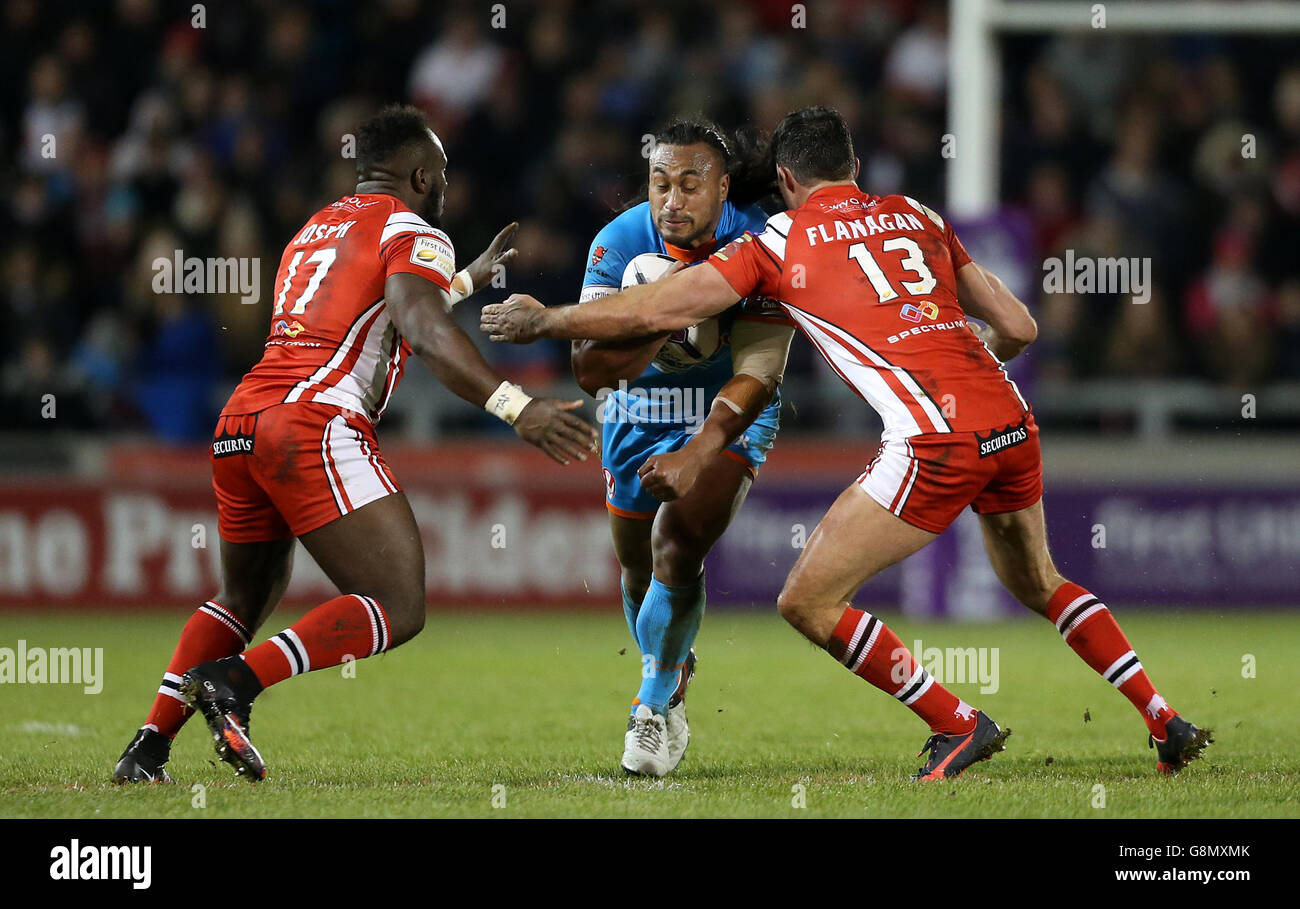 Salford Red Devils' Phil Joseph (left) and Mark Flanagan tackle St Helens' Atelea Vea during the First Utility Super League match at the AJ Bell Stadium, Salford. Stock Photo
