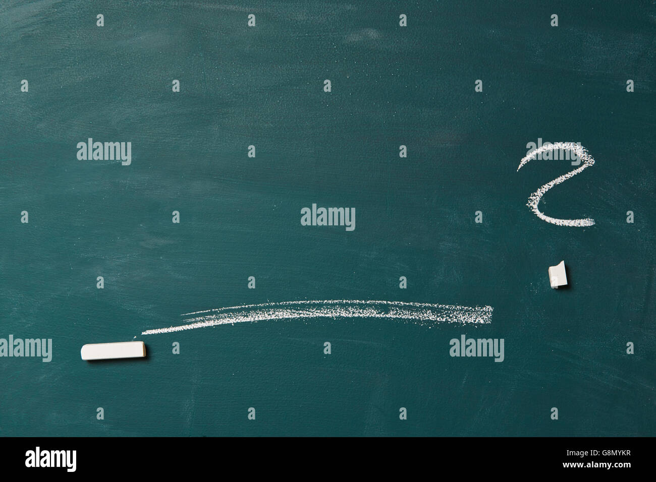 Empty green chalkboard with line,  question mark and a piece of chalk Stock Photo