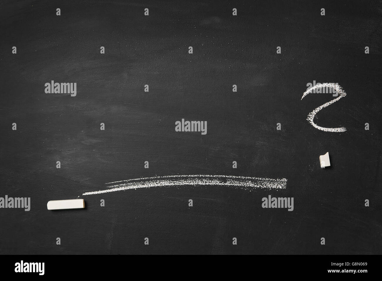 Empty blackboard with line, question mark and a piece of chalk Stock Photo