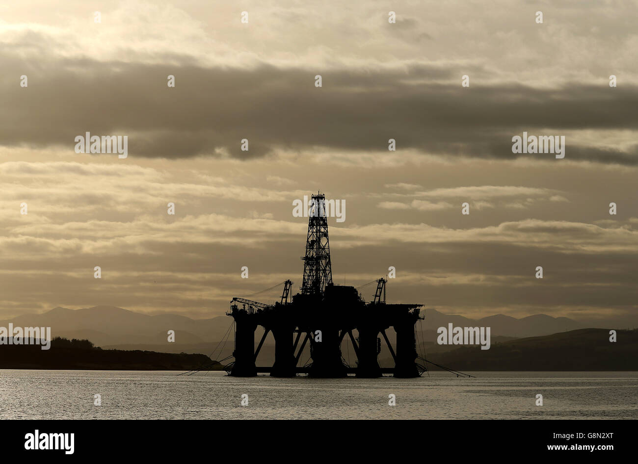 An oil platform stands amongst other rigs which have been left in the ...