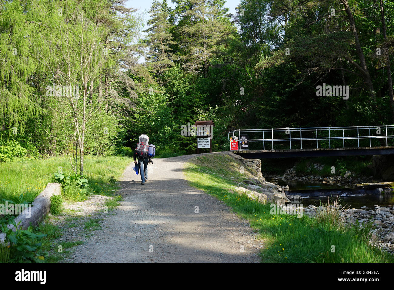 Walker coming into a campsite at Tyndrum, Scotland, UK. Stock Photo