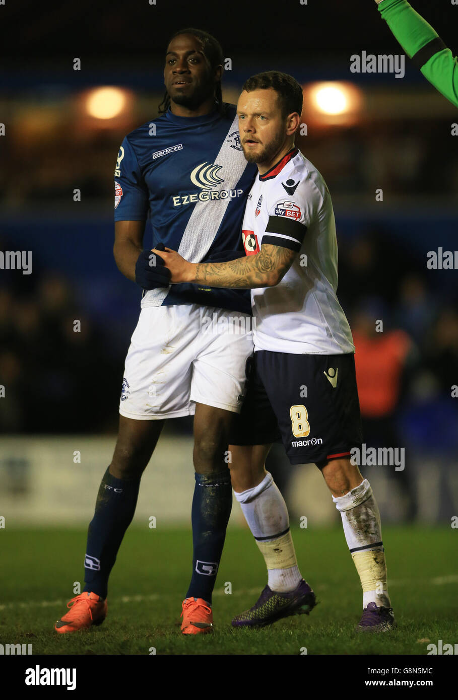 Birmingham City's Clayton Donaldson (left) battle for possession with Bolton Wanderers' Jay Spearing during a corner Stock Photo