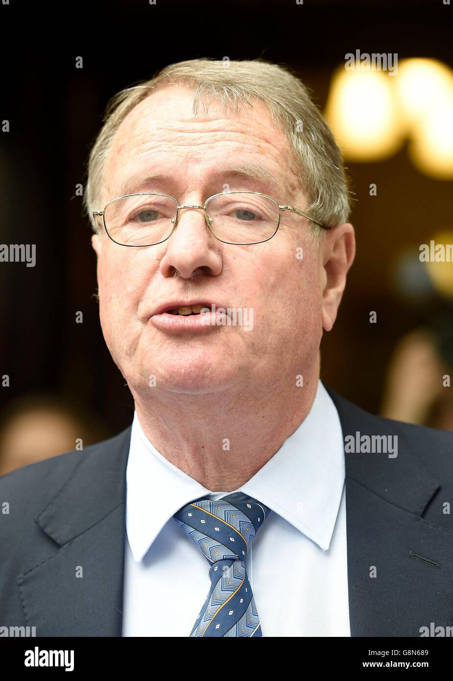 Clifford Chance lawyer Richard Gifford reads a statement outside the