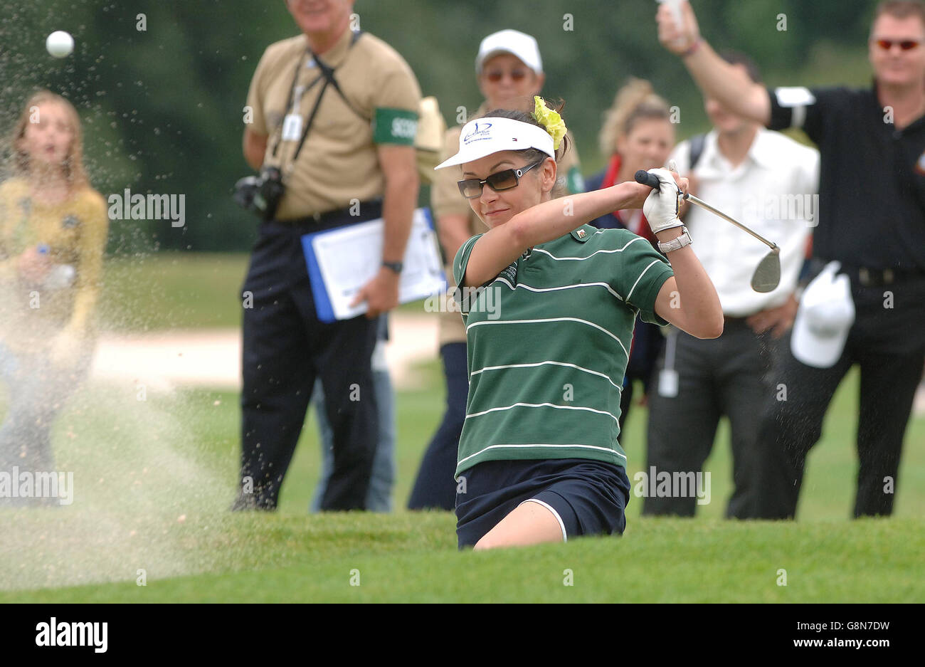 European team member Catherine Zeta-Jones hits a shot from the bunker on the ninth green during the second and last day of the All Star Cup celebrity golf tournament, Monday 29 August 2005, which is being held at the Celtic Manor Resort near Newport, Wales. PRESS ASSOCIATION Photo. Photo credit should read: Steve Parsons/PA Stock Photo