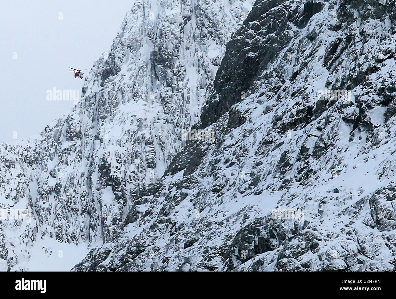 A Coastguard Search and Rescue helicopter searches along the north face of Ben Nevis for missing climbers Rachel Slater, 24, and Tim Newton, 27, as efforts to locate the couple have been been delayed by more bad weather. Stock Photo