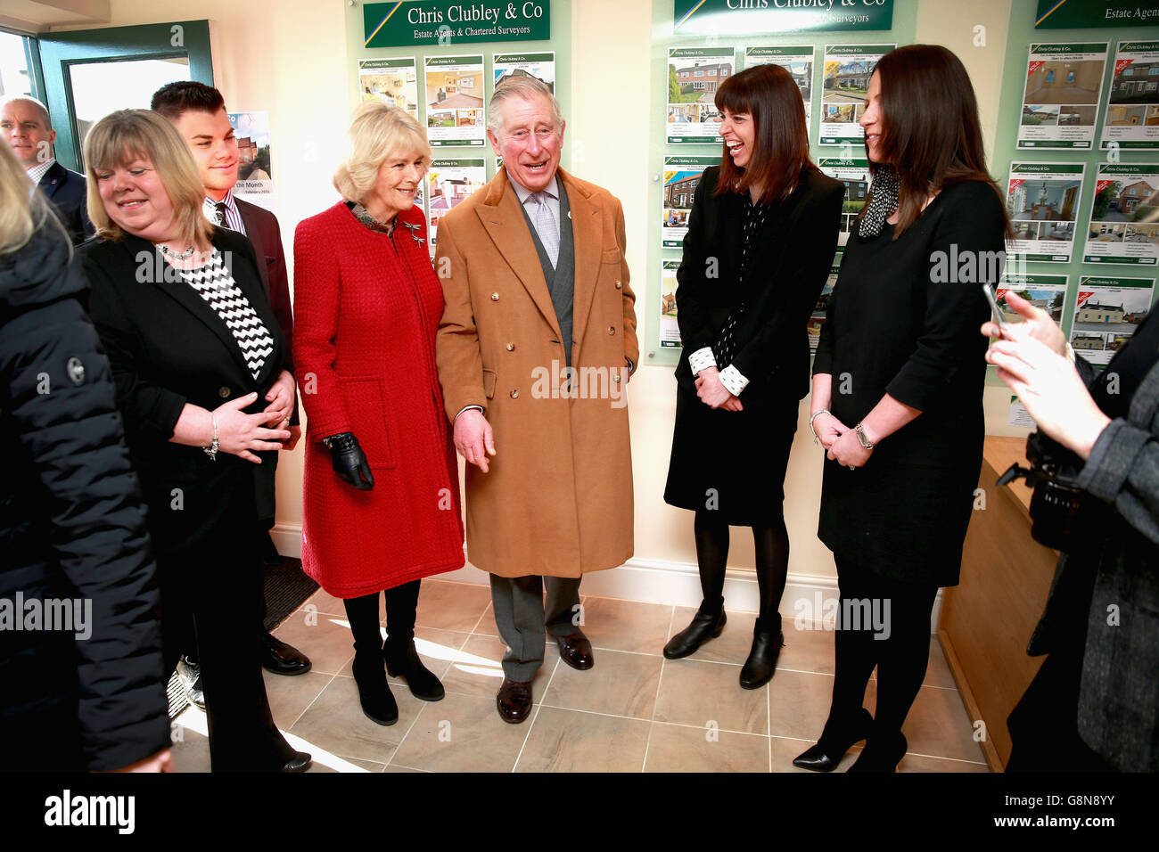 The Prince of Wales and the Duchess of Cornwall talk to staff in Chris