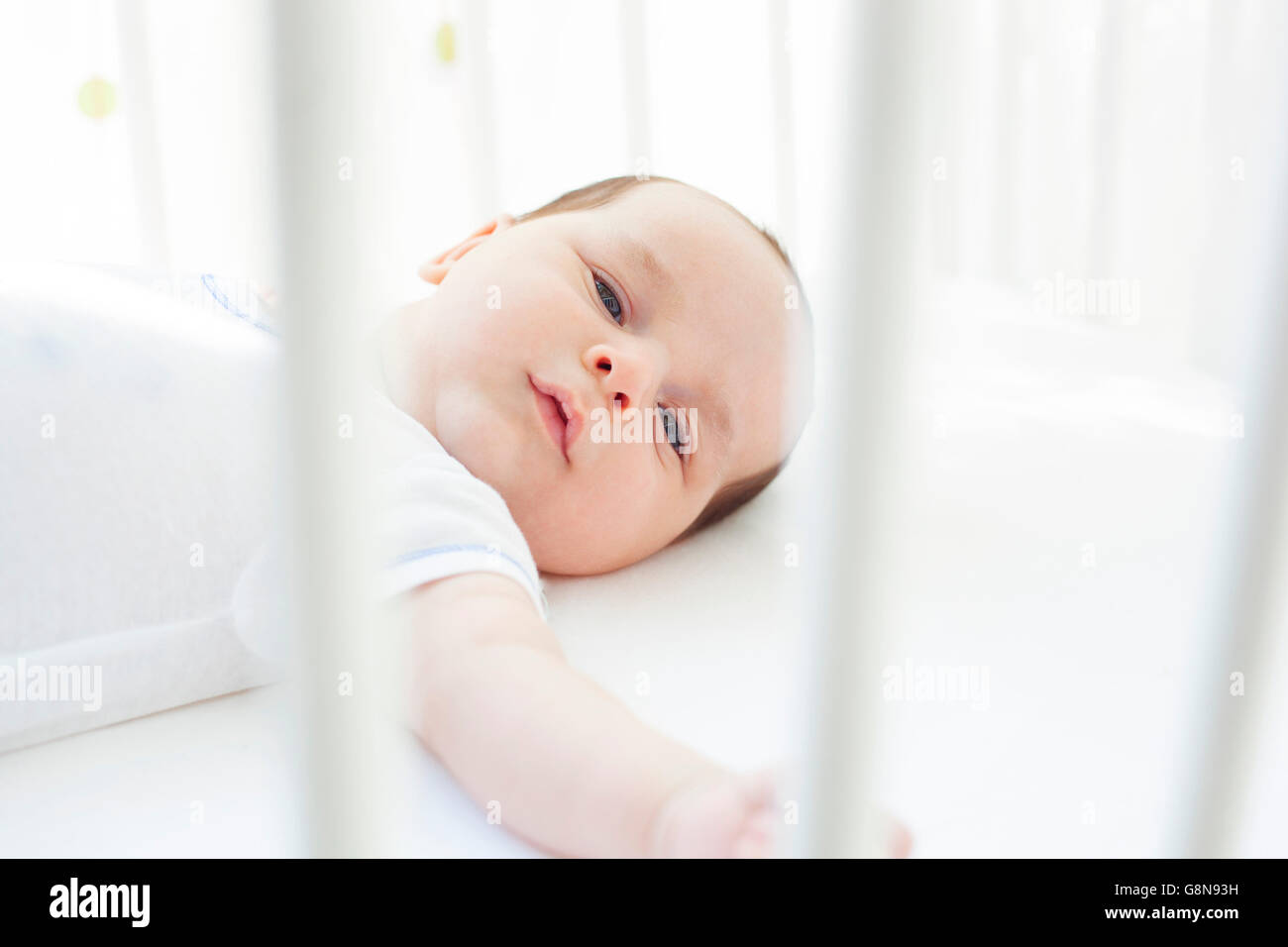 Baby in crib Stock Photo Alamy