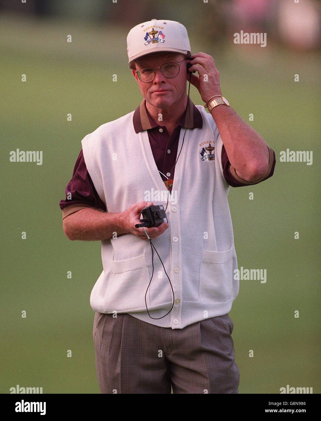 USA's captain Tom Kite keeps in contact as he follows his team around