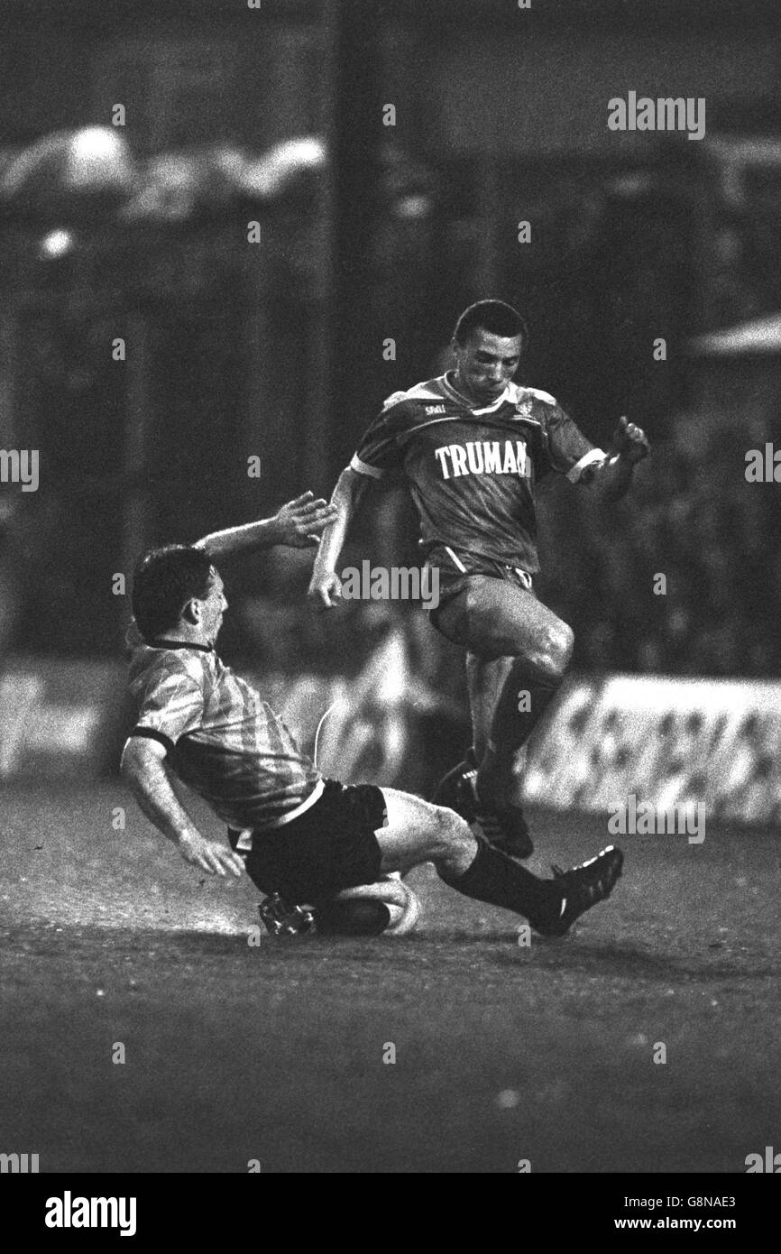 Portsmouth's Kevin Ball (l) slides in to challenge Wimbledon's Terry Phelan during the Barclays League Division One match at Plough Lane. Stock Photo