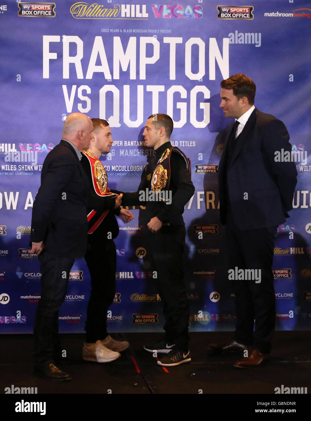 Carl Frampton (centre left) and Scott Quigg (centre right) alongside promoters Barry McGuigan and Eddie Hearn go head to head after a press conference at the Radisson Blu Hotel, Manchester. Stock Photo