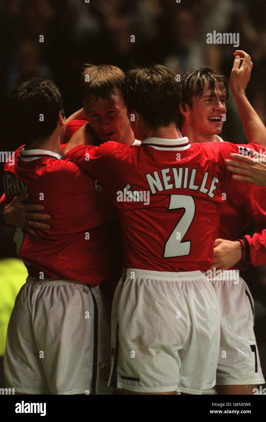 Manchester United goalscorer Teddy Sheringham (second left) is congratulated by team-mates Denis Irwin (left), Gary Neville (second right) and David Beckham (right) Stock Photo