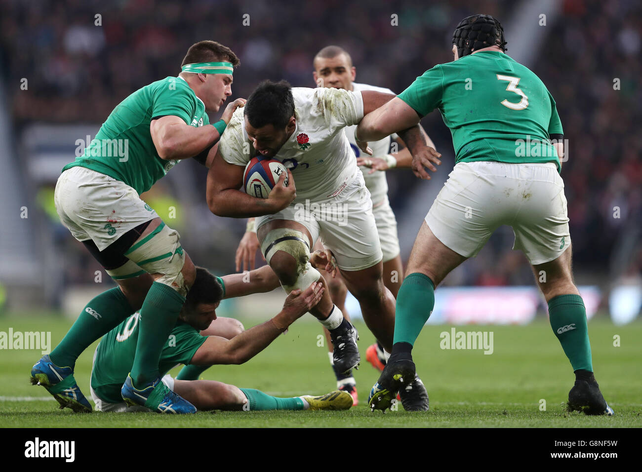 England's Mako Vunipola (centre) is tackled by Ireland's CJ Stander (left) and Mike Ross during the 2016 RBS Six Nations match at Twickenham Stadium, London. PRESS ASSOCIATION Photo. Picture date: Saturday February 27, 2016. See PA story RUGBYU England. Photo credit should read: David Davies/PA Wire. RESTRICTIONS: , No commercial use without prior permission, please contact PA Images for further information: Tel: +44 (0) 115 8447447. Stock Photo