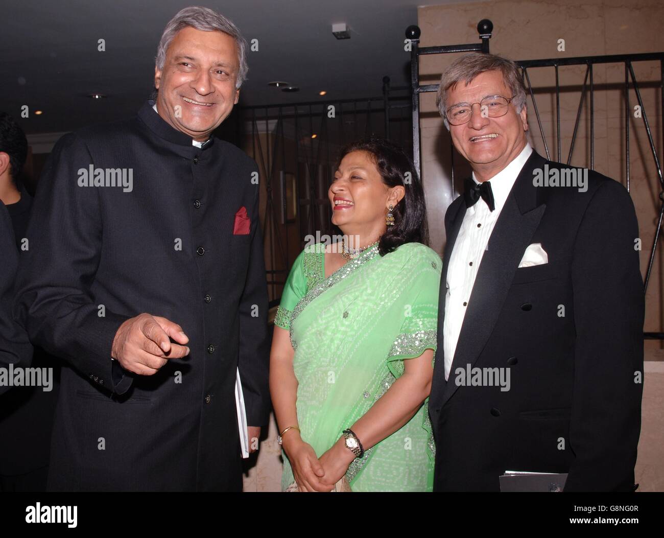 The High Commissioner for India, Kanlesh Sharma (left) and his wife Mrs Mohini Sharma with Sir Goolam Noon MBE, Chairman of Noon Products, at a Park Lane reception to launch Asian Power 100, a list of the 100 most successful and influential British Asians. Stock Photo