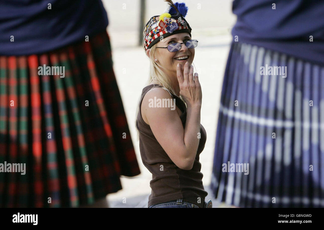 Norwegian Eleonora Margrethe Fjar Lindland (30) wearing a glengarry hats looks at a kilted Scotsman in Oslo, Norway, Tuesday September 6, 2005 ahead of Scotland's match against Norway in a World Cup qualifier tomorrow evening. PRESS ASSOCIATION Photo. Photo credit should read: Andrew Milligan/PA Stock Photo