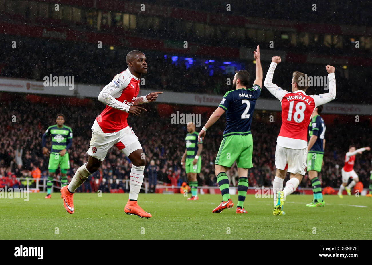 Arsenal v Swansea City - Barclays Premier League - Emirates Stadium. Arsenal's Joel Campbell (left) celebrates scoring his side's first goal of the game Stock Photo