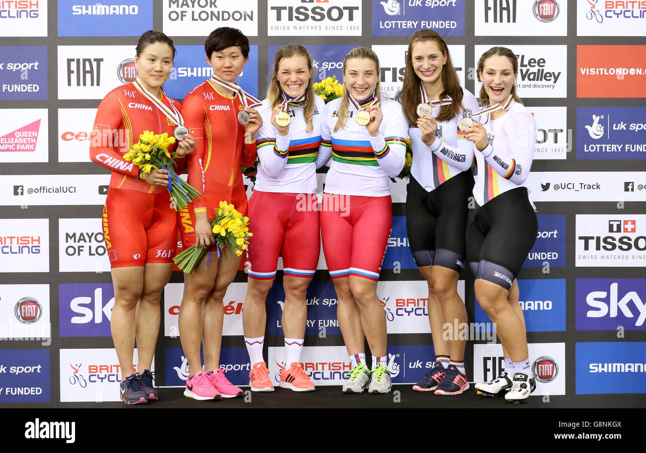 Russia's Daria Scmeleva (centre right) and Anastasiia Voinova (centre left) with their gold medals on the podium alongside silver medalists China's Jinjie Gong and Tianshi Zhong (left) and bronze medalists Germany's Miriam Welte and Kristina Vogel (right) after the Women's Team Sprint during day one of the UCI Track Cycling World Championships at Lee Valley VeloPark, London. Stock Photo