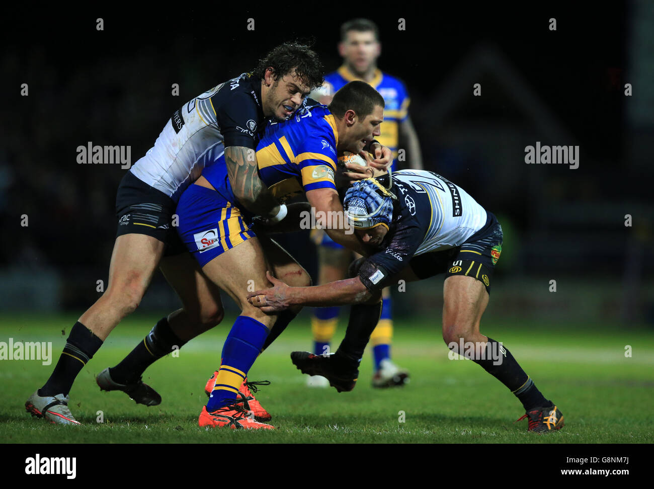 North Queensland Cowboys Ethan Lowe (left) and Johnathan Thurston tackle Leeds Rhinos Ryan Hall during the World Club Series match at Headingley Stadium, Leeds. Stock Photo