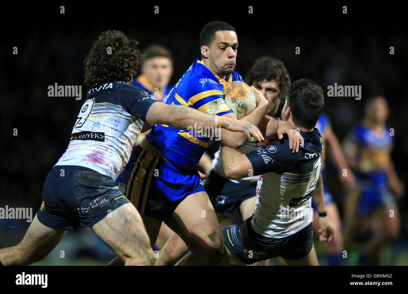 North Queensland Cowboys Jake Granville (left) and Lachlan Coote tackle Leeds Rhinos Josh Walters during the World Club Series match at Headingley Stadium, Leeds. Stock Photo