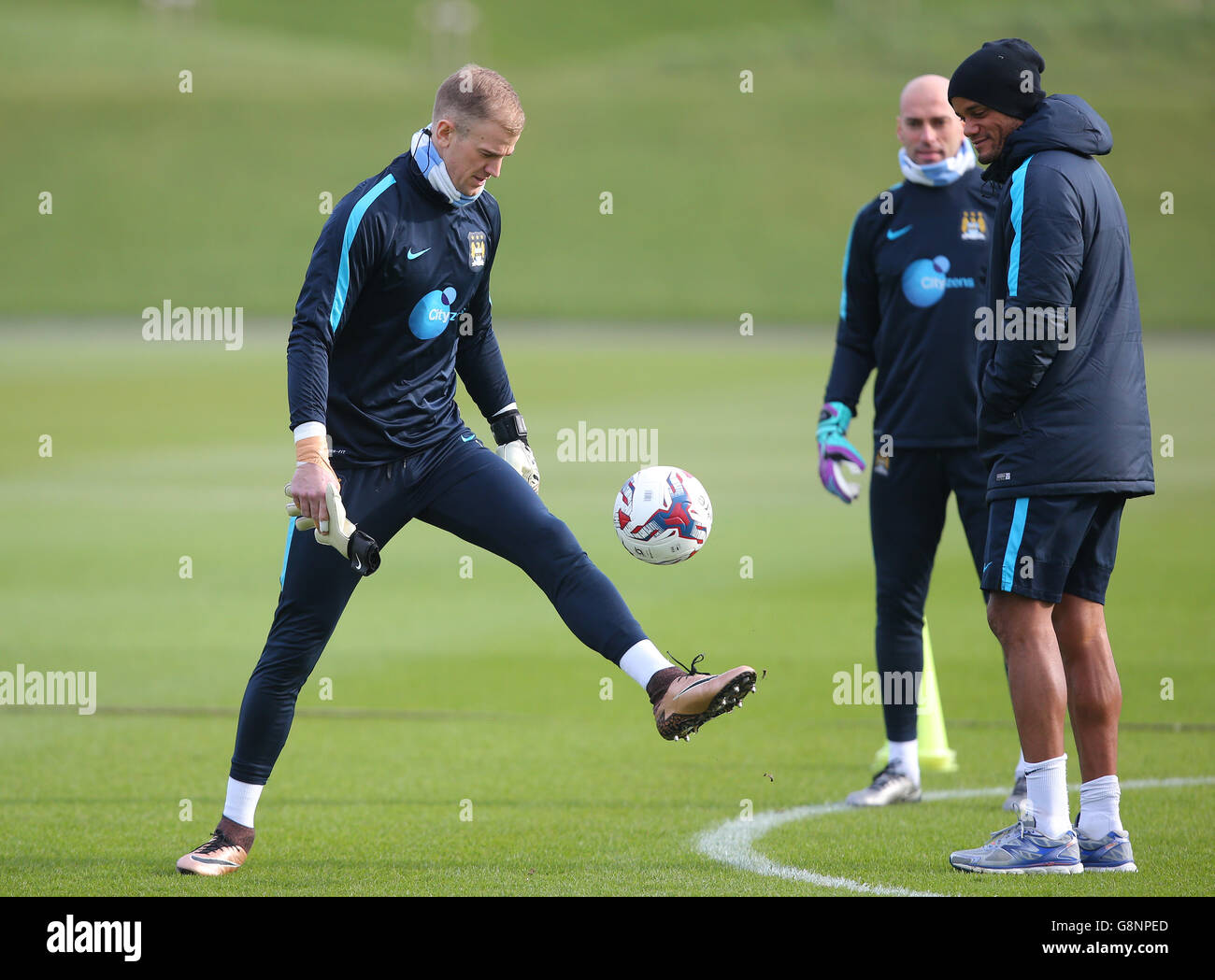 Manchester City goalkeeper Joe Hart, Willy Caballero and Vincent Kompany during a training session ahead of the Capital One Cup Final, at City Football Academy, Manchester. Stock Photo