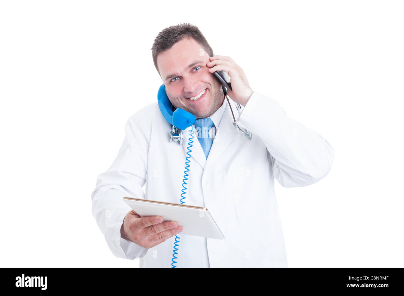 Male medic or doctor smiling being busy and multitasking with phone and ...