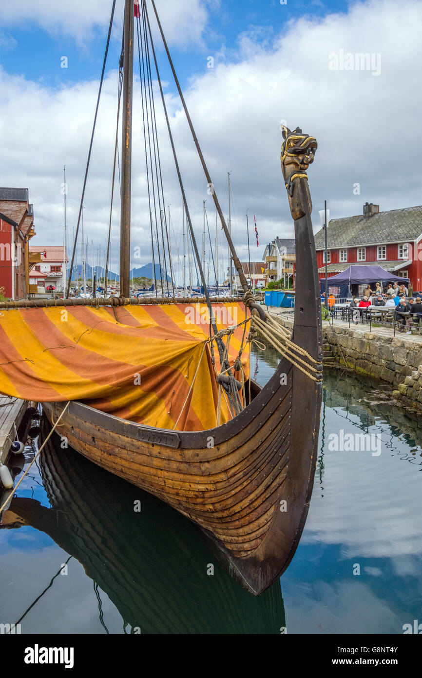 Lofotr (viking long-ship) reconstruction with orange sail, in harbour harbor, Kabelvag, Lofoten Islands, Norway Stock Photo