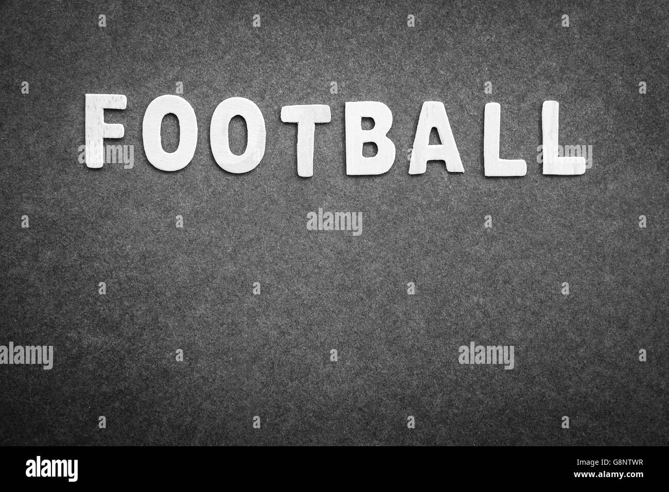 Gray background with word football on it, abstract football backdrop with text space, score board Stock Photo