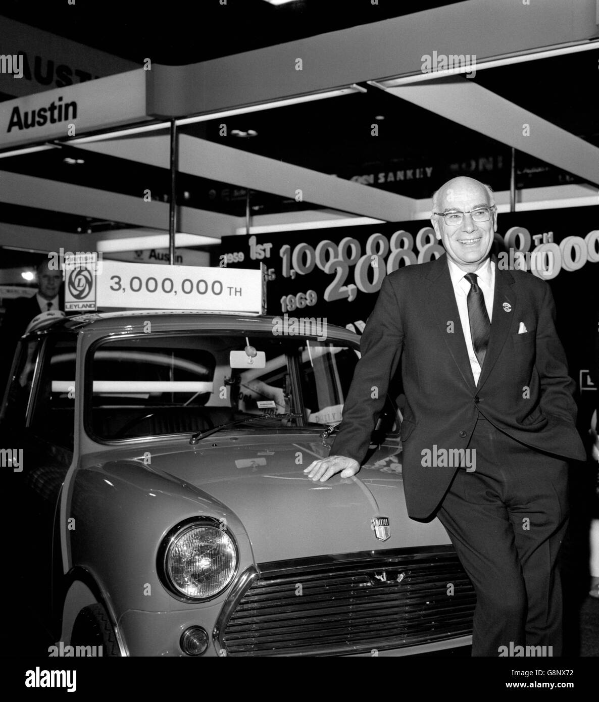 Lord Stokes, British Leyland chairman, stands beside the three millionth Mini, a Blaze Mini 1000 built for the home market at the Austin Morris Stand at the Earls Court Motor Show. Stock Photo