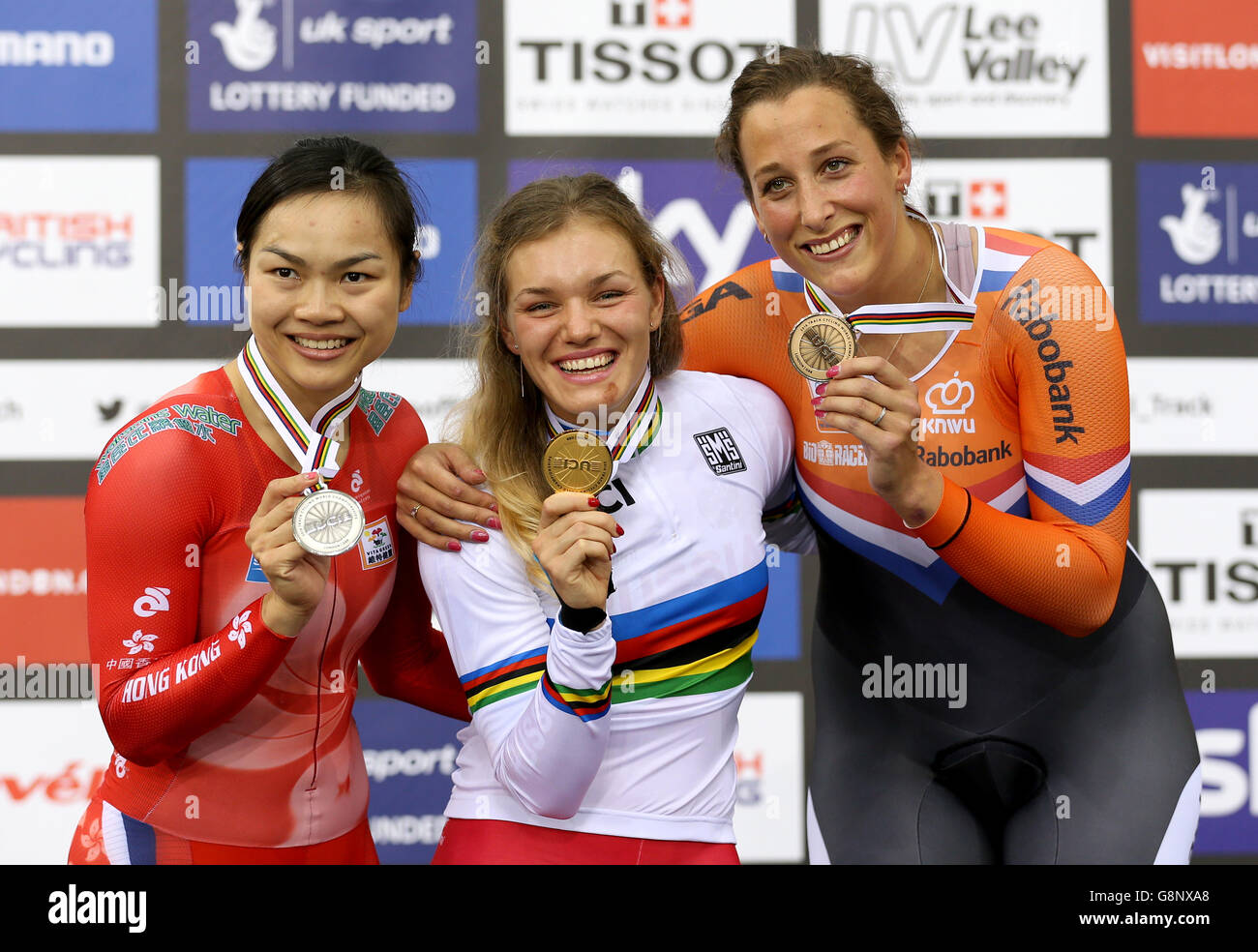 Gold medalist Russia's Anastasiia Voinova (centre) silver medalist Hong Kong's Wai Sze Lee (left) and bronze medalist Netherland's Elis Lightlee after the Women's 500m Time Trial during day three of the UCI Track Cycling World Championships at Lee Valley VeloPark, London. PRESS ASSOCIATION Photo. Picture date: Friday March 4, 2016. See PA story CYCLING World. Photo credit should read: Tim Goode/PA Wire. Stock Photo