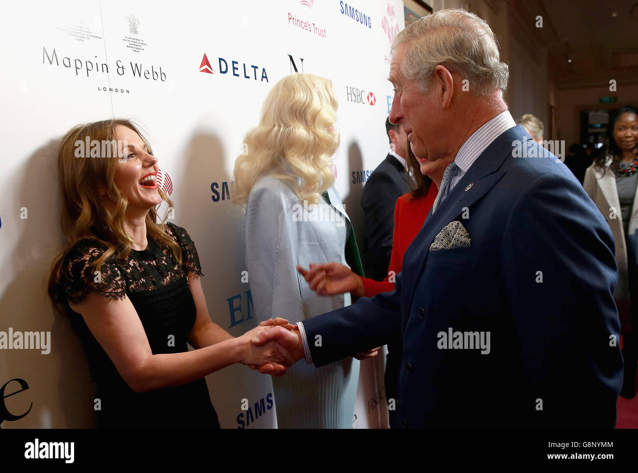 The Prince of Wales talks to Geri Horner and Rita Ora backstage during