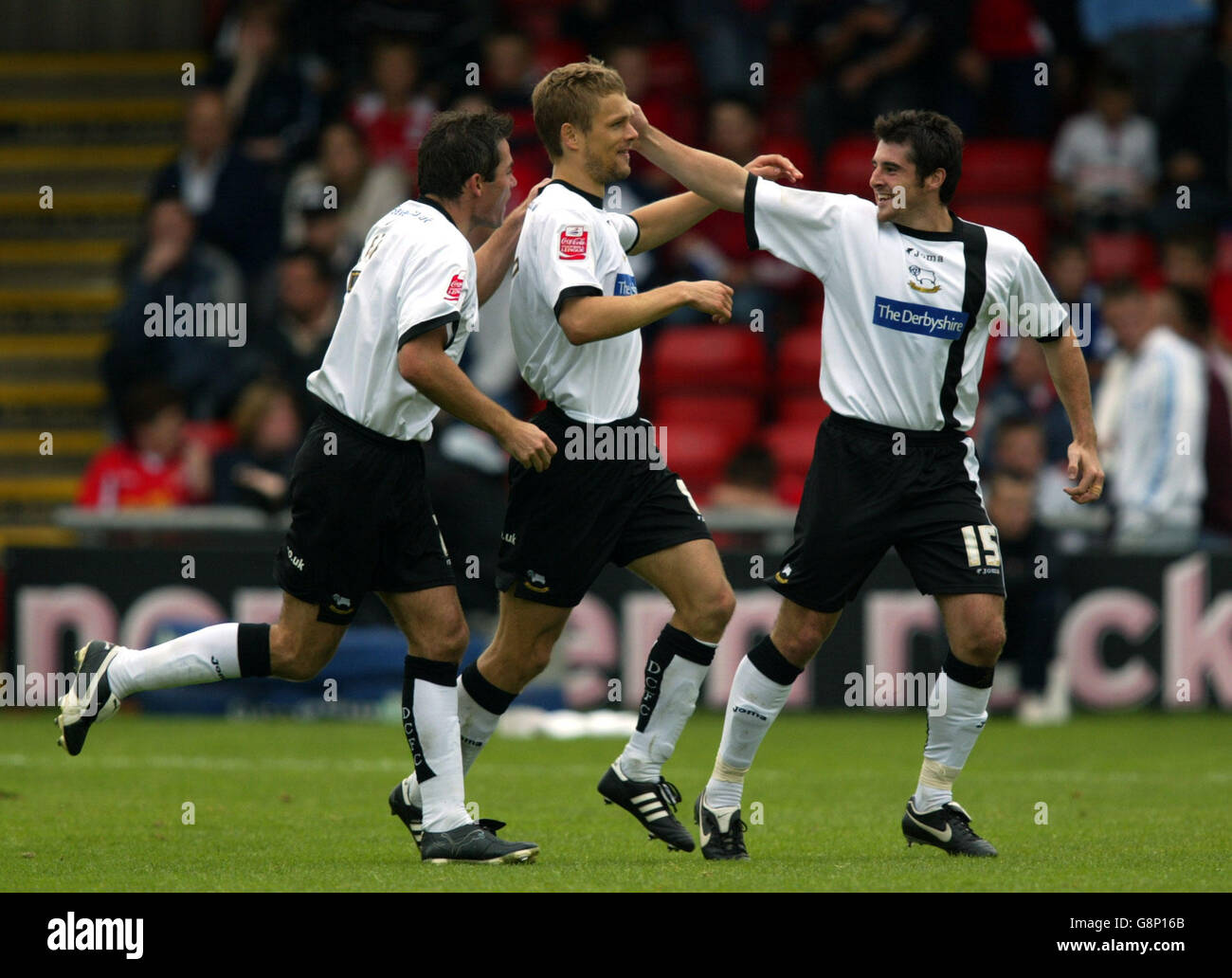 Soccer - Coca-Cola Football League Championship - Crewe Alexandra v Derby County - Gresty Road. Derby County's Morten Bisgaard (centre) celebrates his goal against Crewe Alexandra with Jeff Kenna (L) and Adam Bolder (R). Stock Photo