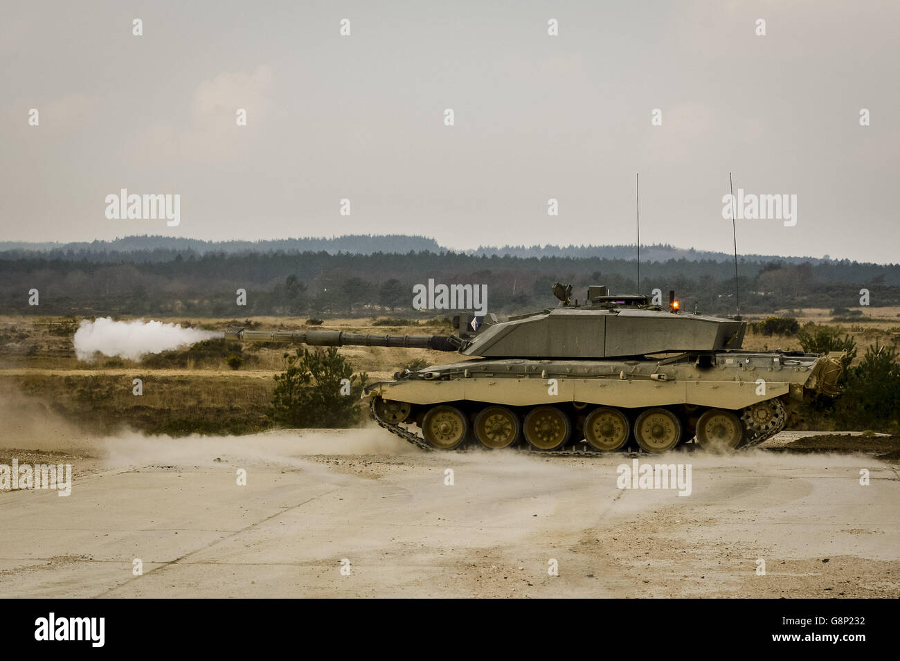 A Challenger II Main Battle Tank takes part in live firing at Lulworth Gunnery Range, Dorset, where Army Reservists from the Royal Wessex Yeomanry (RWxY) are training as part of the UK's Reaction Force. Stock Photo