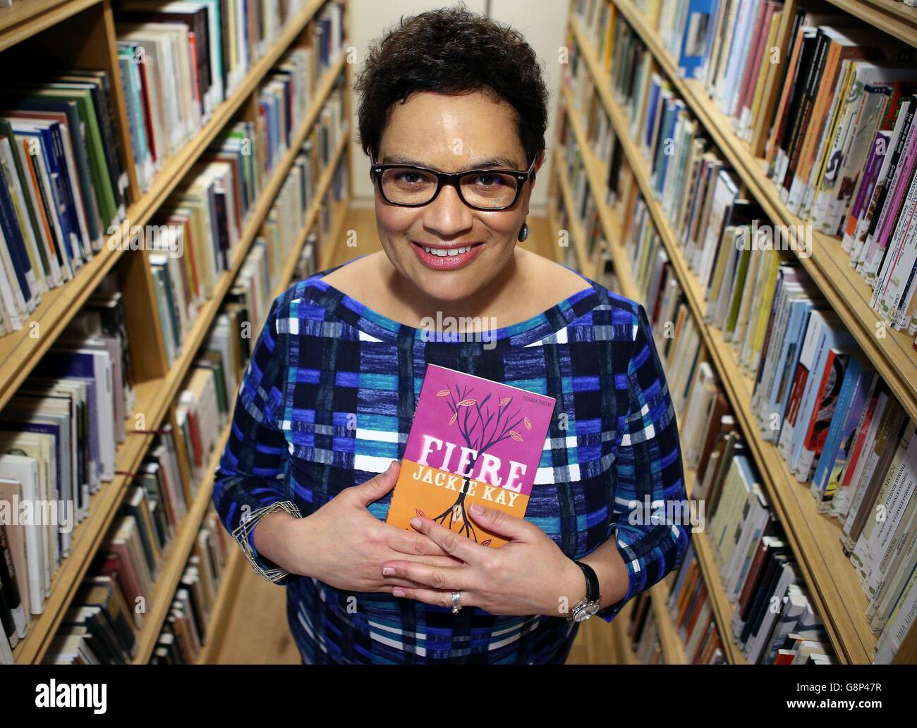 New Makar Jackie Kay (National Poet for Scotland) with her book Fiere at the Scottish Poetry Library in Edinburgh. Stock Photo