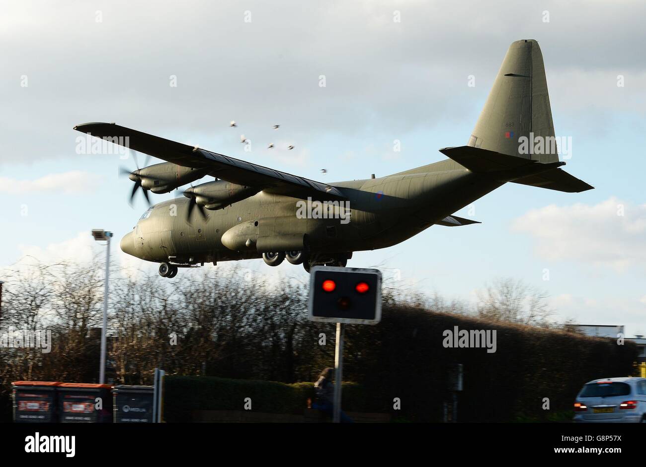 A RAF Hercules transport plane prepares to land at RAF Northolt carrying Pauline Cafferley, who contracted the Ebola disease while working as a nurse in Sierra Leone in December 2014, and is now being transferred to the London Free Hospital for the third time. Stock Photo