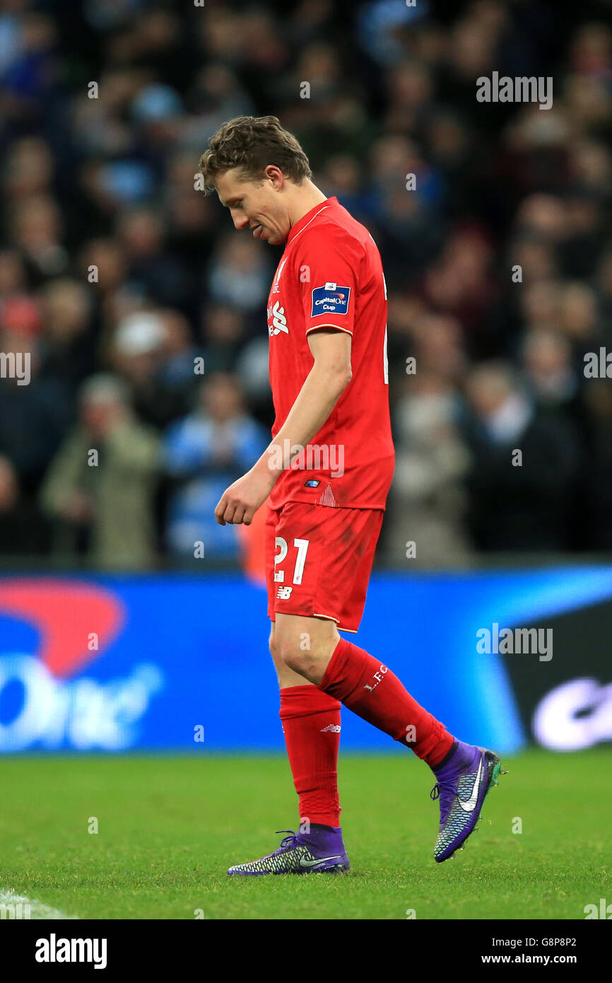 Liverpool's Lucas Leiva stands dejected after Manchester City goalkeeper Willy Caballero saves his penalty in the shoot-out during the Capital One Cup final at Wembley Stadium, London. Stock Photo