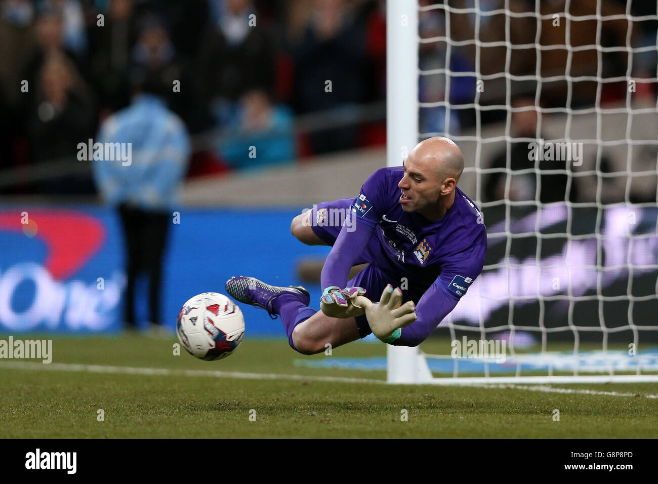 Manchester City goalkeeper Willy Caballero saves a penalty during the shoot out Stock Photo