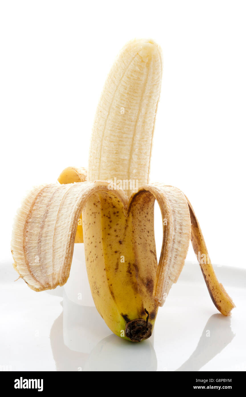 A Yellow Banana Fruit Peeled and Isolated on White Stock Photo