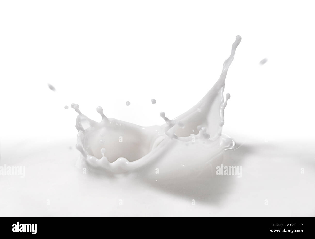 A Milk Splash Over White Background Stock Photo - Alamy