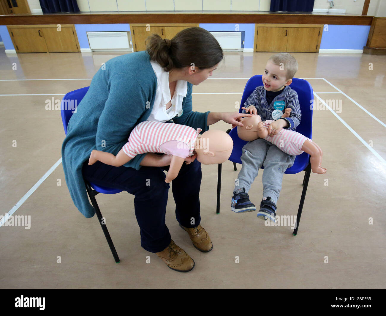 Dispute over doctors' contracts. Dr Laura Pocock teaches Jake Perkins, 3, life-saving techniques at Ashington Community Centre in West Sussex as Junior doctors in England who are involved in the 48-hour industrial action take part in free life-saving training sessions in their local communities. Stock Photo