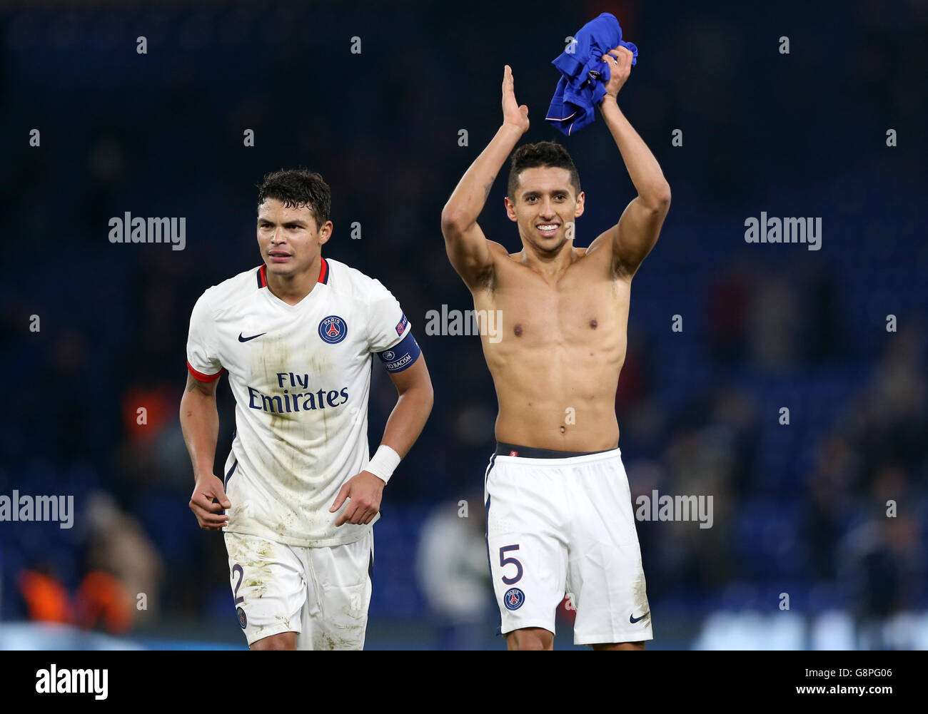 Paris Saint Germain's Marquinhos (right) and Thiago Silva (left) celebrate victory after the UEFA Champions League, Round of Sixteen, Second Leg match at Stamford Bridge, London. Stock Photo