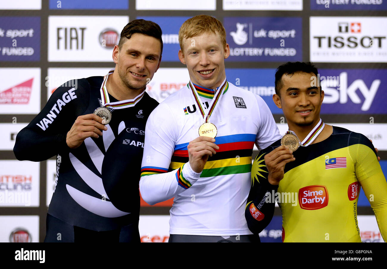 Gold medalist Germany's Joachim Eilers (centre) silver medalist New Zealand's Edward Dawkins (left) and bronze medalist Malaysia's Azizulhasni Awang after the Men's Keirin during day five of the UCI Track Cycling World Championships at Lee Valley VeloPark, London. PRESS ASSOCIATION Photo. Picture date: Sunday March 6, 2016. See PA story CYCLING World. Photo credit should read: Tim Goode/PA Wire. Stock Photo
