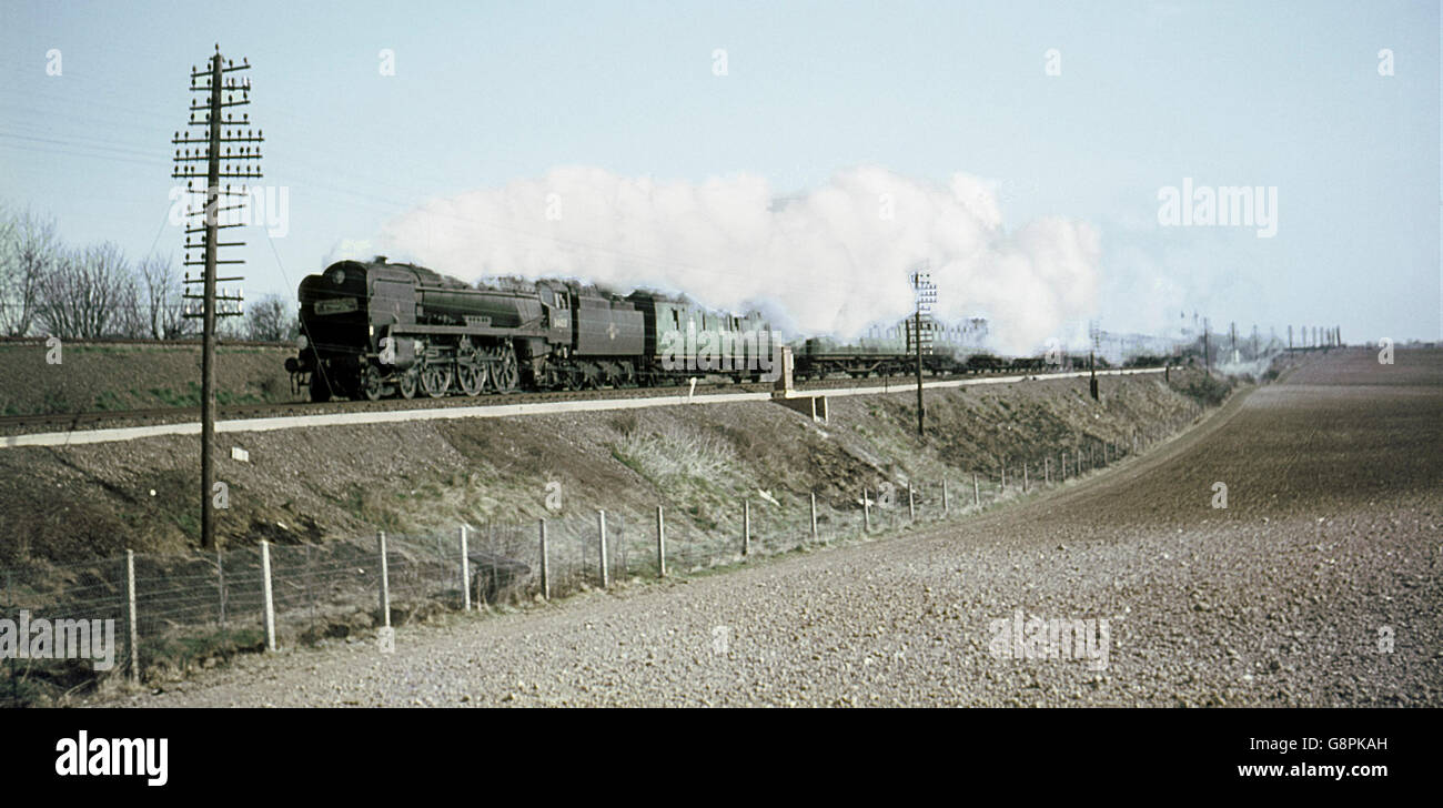 An unidentified Bulleid West Country Pacific races through the Hampshire countryside with an express for London Waterloo. Stock Photo