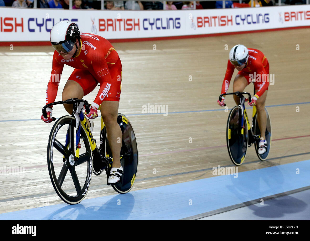 China's Tianshi Zhong (left) and Jijnje Gong compete in the Women's Team Sprint during day one of the UCI Track Cycling World Championships at Lee Valley VeloPark, London. Stock Photo