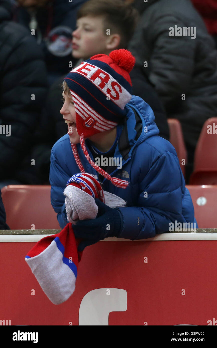 Stoke v Aston Villa - Barclays Premier League - Britannia Stadium. A Stoke City fan in the stand shows support Stock Photo