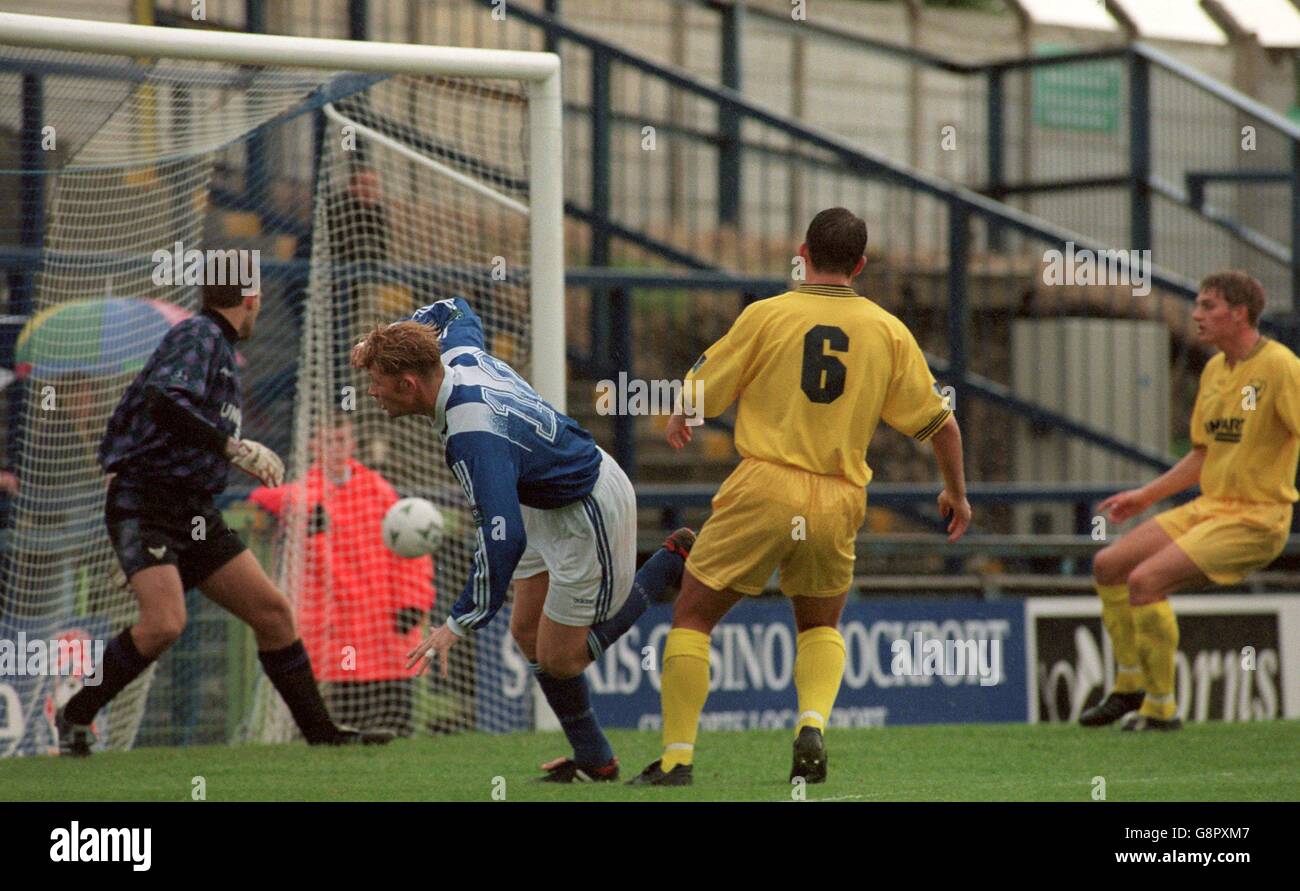 Stockport County's Alun Armstrong (second left) scores as Oxford United's Arjan Van Heusden