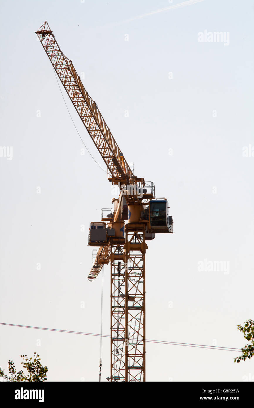 yellow crane against sky Stock Photo