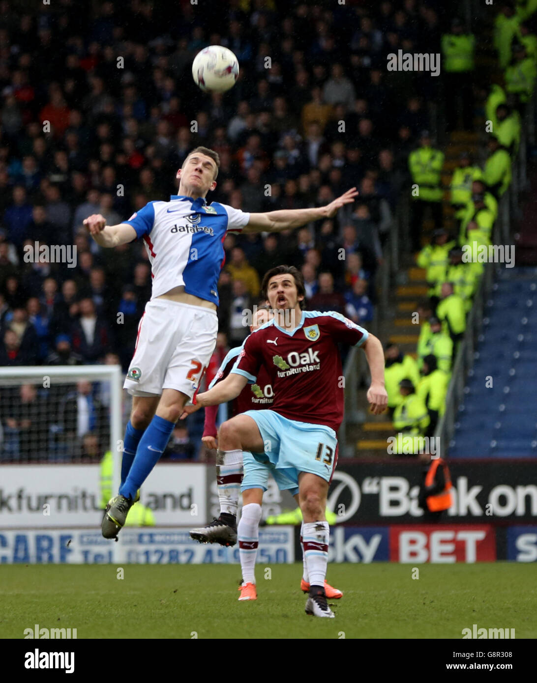 Blackburn Rovers' Darragh Lenihan (left) and Burnley's Joey Barton battle for the ball during the Sky Bet Championship match at Turf Moor, Burnley. Stock Photo
